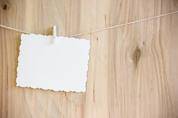 white sheet on clothespins hang on thread