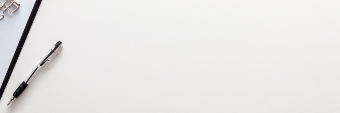 White office desk with copy space. View from above. Office supplies. Panoramic photo