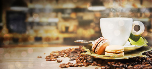 Coffee cup and beans on old kitchen table.