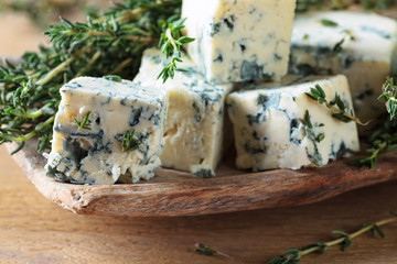 Pieces of blue cheese with thyme.