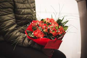a beautiful bouquet of colored roses awaits to be delivered to the lucky one