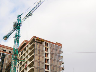 Construction crane near the building under construction 689093456