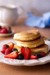 Trendy homemade japanese pancakes for breakfast with berries