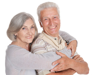 Close up portrait of happy senior couple hugging