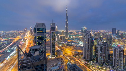 Fototapeta na wymiar Beautiful panoramic skyline of Dubai day to night timelapse, United Arab Emirates. View of world famous skyscrapers.