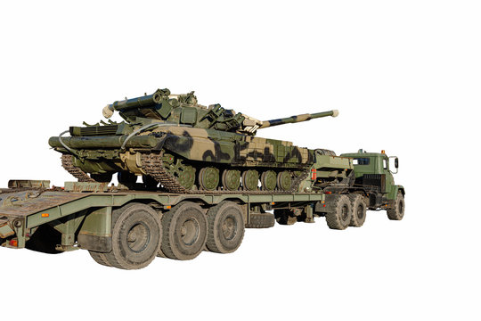 Army tank on a platform of a tank transporter truck on a white background. Military medium tank.