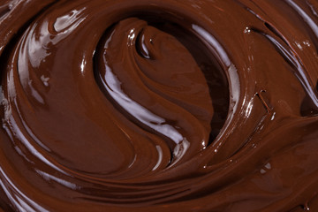 Chocolate texture. Liquid chocolate close-up.Textured dark chocolate