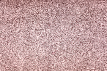 Texture of an old colored plaster coating of a stone wall surface.