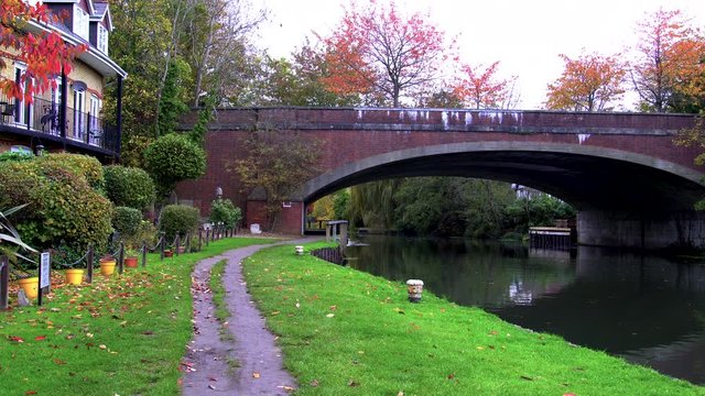 River Wey Towpath, Wharf pool and bridge on River Wey Navigation, Canal and River system, at Weybridge, Surrey, England, UK.