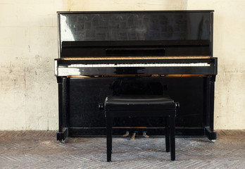 Fototapeta na wymiar Old piano on the street of Matera town, Italy
