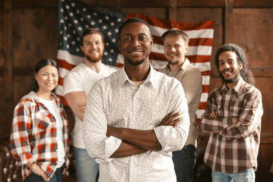 Diverse American Patriotic Team Standing On Of American's Flag Back