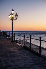 Pier in Amalfi town at sunset, Italy