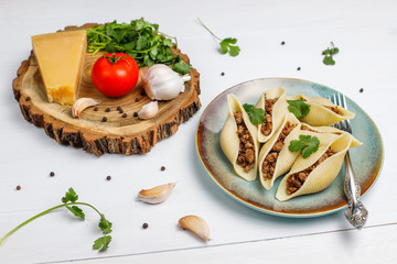 Italian pasta Conchiglioni Rigati stuffed with meat.