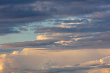Clouds in the sky at sunset as a background