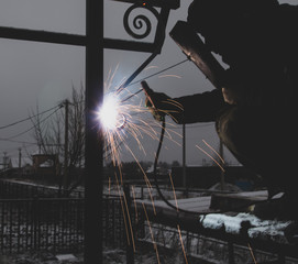 sparks from metal welding at a construction site