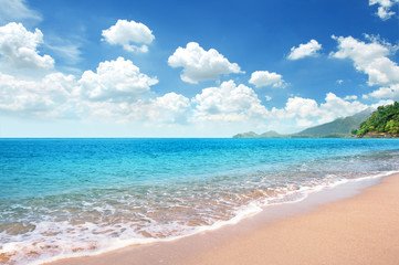Beautiful Sandy Beach with Good Weather Day and bright blue sky fully with cloudscape