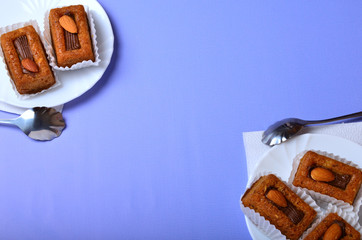 Bisquit cakes on blue background isolated