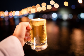 Drinking beer at the river at night