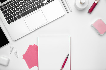 Sheets and devices. Flat lay, mock-up. Feminine home office workspace, copyspace. Inspiring workplace for productivity. Concept of business, fashion, freelance, finance, artwork. Trendy pastel colors.