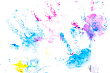 multicolored prints of children's hands and feet on white background. Abstract painted background. Children's art and painting.
