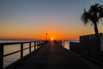 Fototapeta na wymiar Sunset at pier Fraser Island Australia