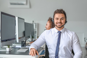 Portrait of male technical support agent in office