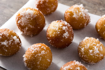 Carnival fritters or buñuelos de viento for holy week on wooden table