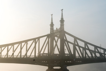 The sunrise on Danube river with the view on Liberty bridge in Budapest