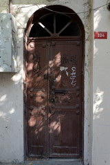 Old door on a building on Bogazkesen street in the old Beyoglu district of Istanbul