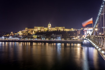 Fototapeta na wymiar Buda Castle, Royal Palace by the Danube river illuminated at night in Budapest