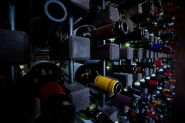 Close upt of bottles in wine cellar