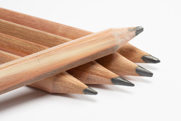 5 wooden pencils macro shot, isolated on whte