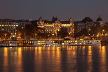 Danube river and illuminated historic boildings at night in Budapest, Hungary