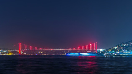 Illuminated bridge over Bosphorus night timelapse. Turkey renames Bosporus Bridge "15th July Martyrs Bridge". Istanbul Turkey.