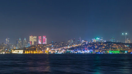 Fototapeta na wymiar Night timelapse view of besiktas district in istanbul taken from asian part of the city.
