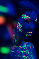 Front view of woman with fluorescent make-up