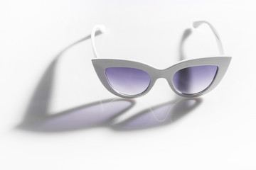 White eyeglasses with shadow on  white background
