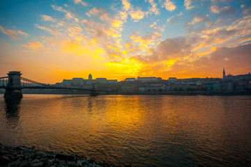 Fototapeta na wymiar Danube river and historic buildings at sunset in Budapest, Hungary