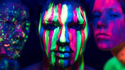 Fluorescent make-up on people faces