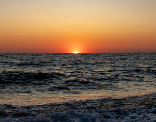 Fototapeta na wymiar Sunset on the Black Sea in Sochi on a summer hot day