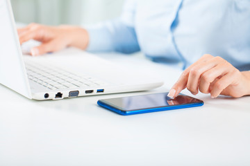 Young business woman working using laptop.