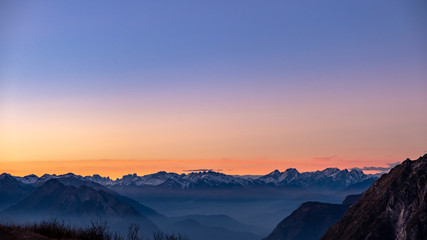 Fototapeta na wymiar Winter sunset from an alpine peak of Friuli-Venezia Giulia