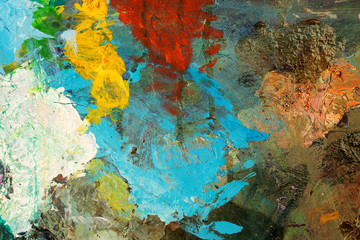 Background image of bright oil-paint palette closeup.
