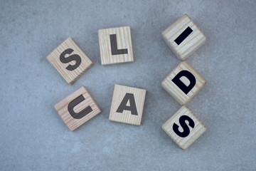 the concept of the word IDS on cubes on a gray background with letters