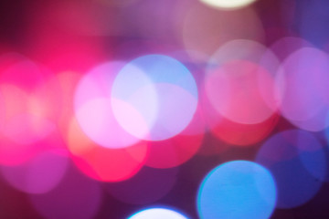 Defocused colored lights and sparkles. Festive background concept. Copy space
