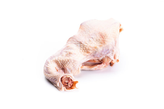 Raw chicken carcass isolated on a white background.