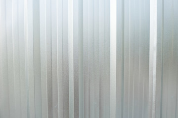 Sliver metal sheet background texture. White corrugated metal surface.