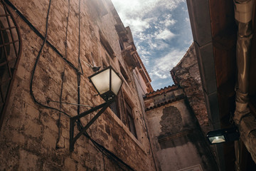 Fototapeta na wymiar In winding narrow streets of Trogir