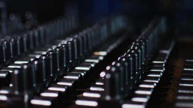 set of metal t-shaped pipe joints on desk in workshop