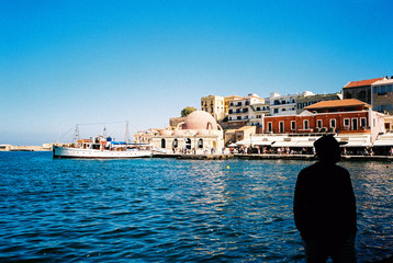 Chania. Crete. Man and the port city